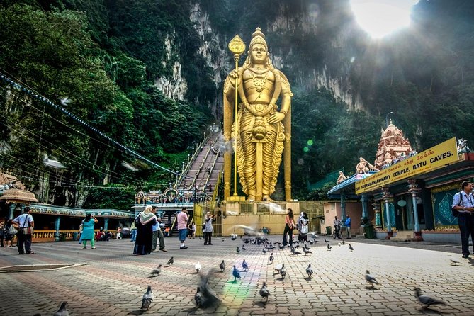 Batu Caves & Malaysian Handicraft Tour: Pewter & Batik Experience - Arriving at Batu Caves and the golden Murugan statue