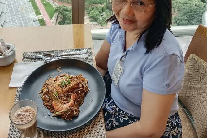 Petronas Twin Towers Special Entrance & Dining With Expert Guide - Meeting at the Formula 1 car between the towers